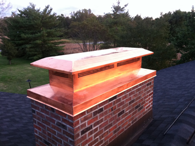 Before and after chimney cap replacement in Oyster Bay, NY