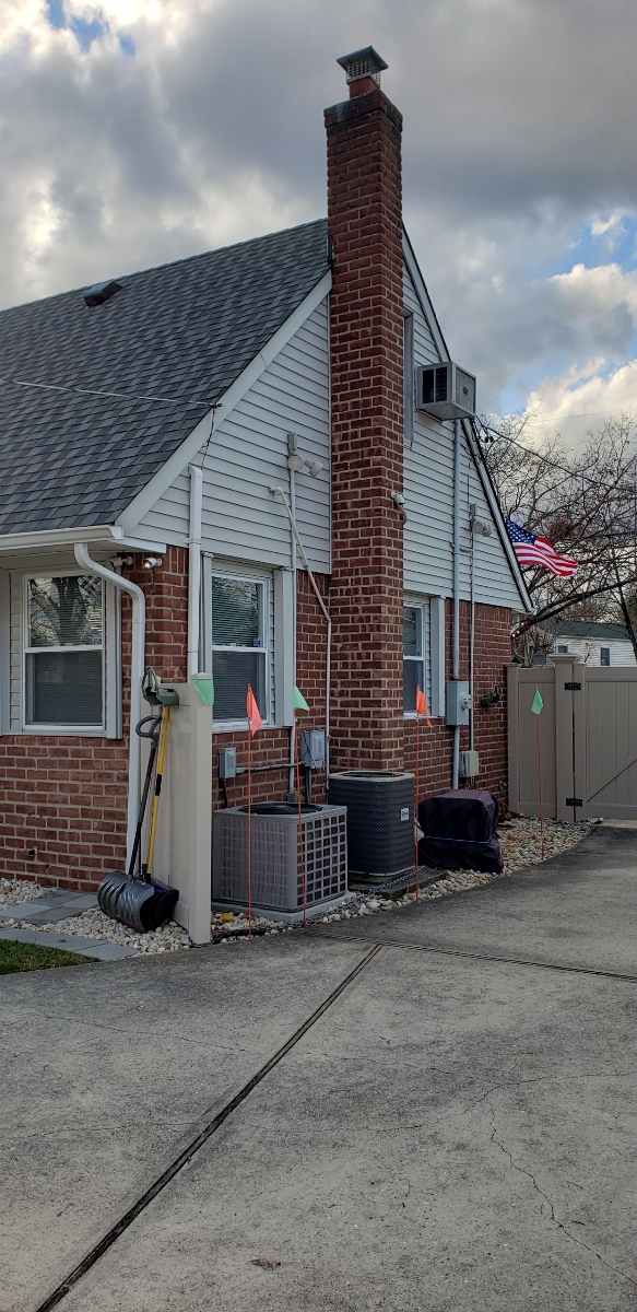 Professional chimney repointing restoring brick joints in Oyster Bay, NY