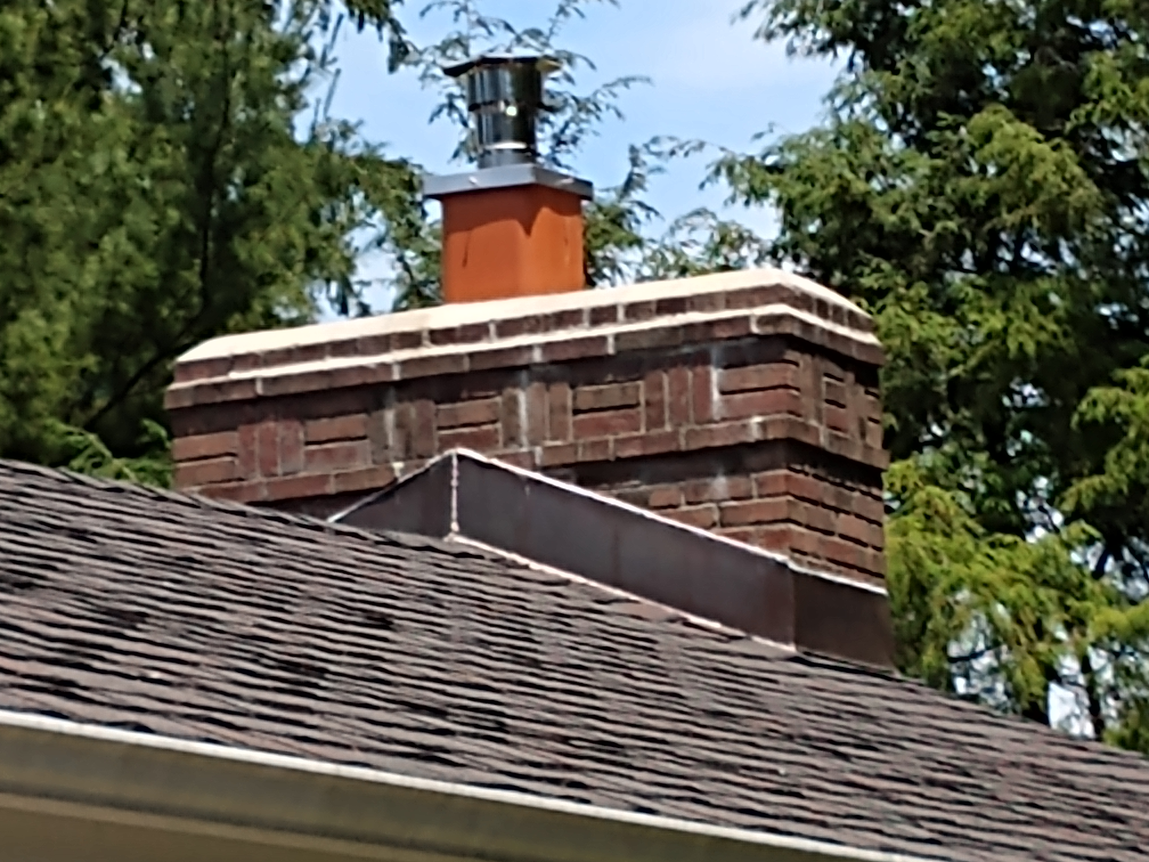 Stainless steel chimney cap with animal guard in Oyster Bay, New York